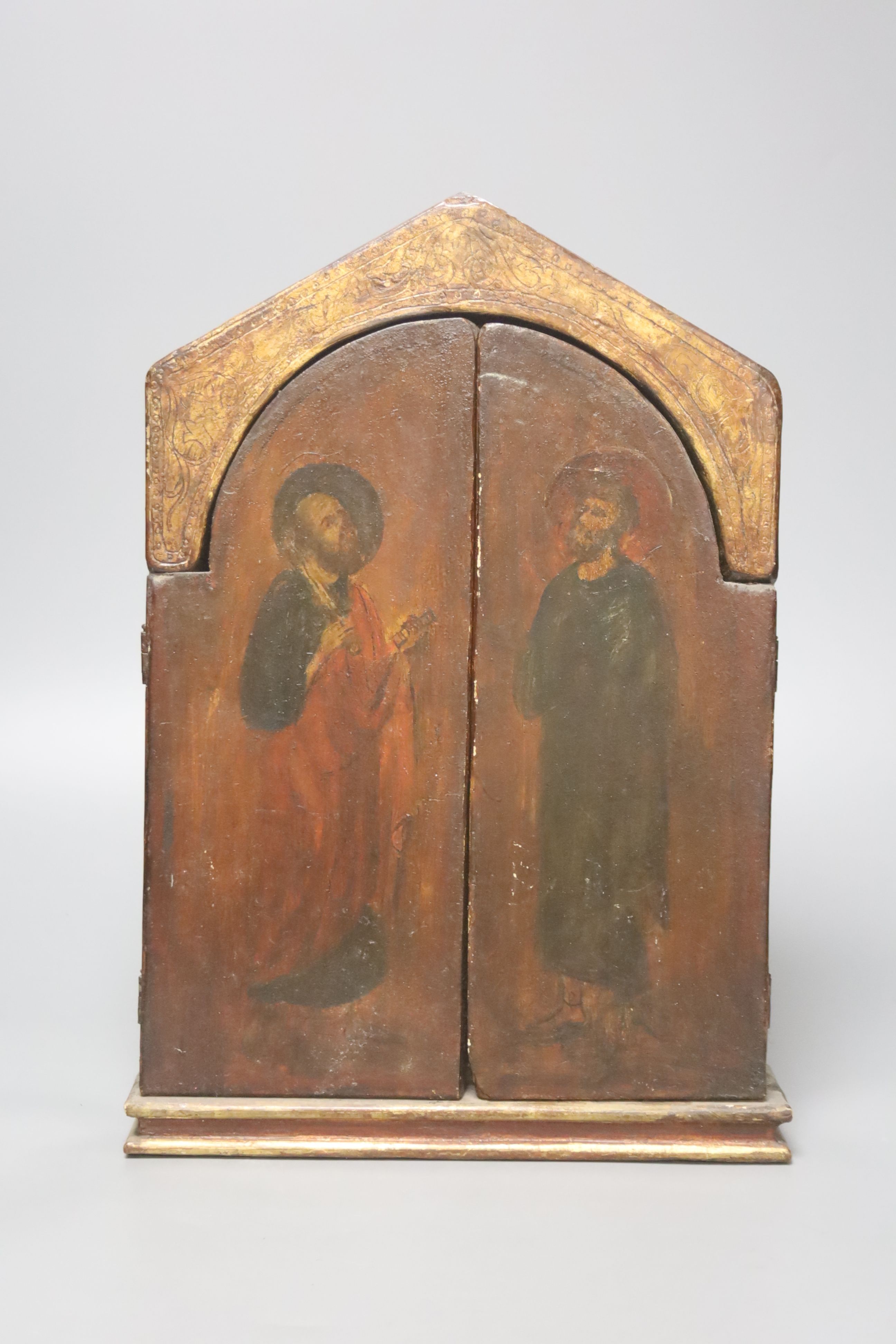 A painted hinged triptich icon, 36 x 37cm (open) 24cm wide closed